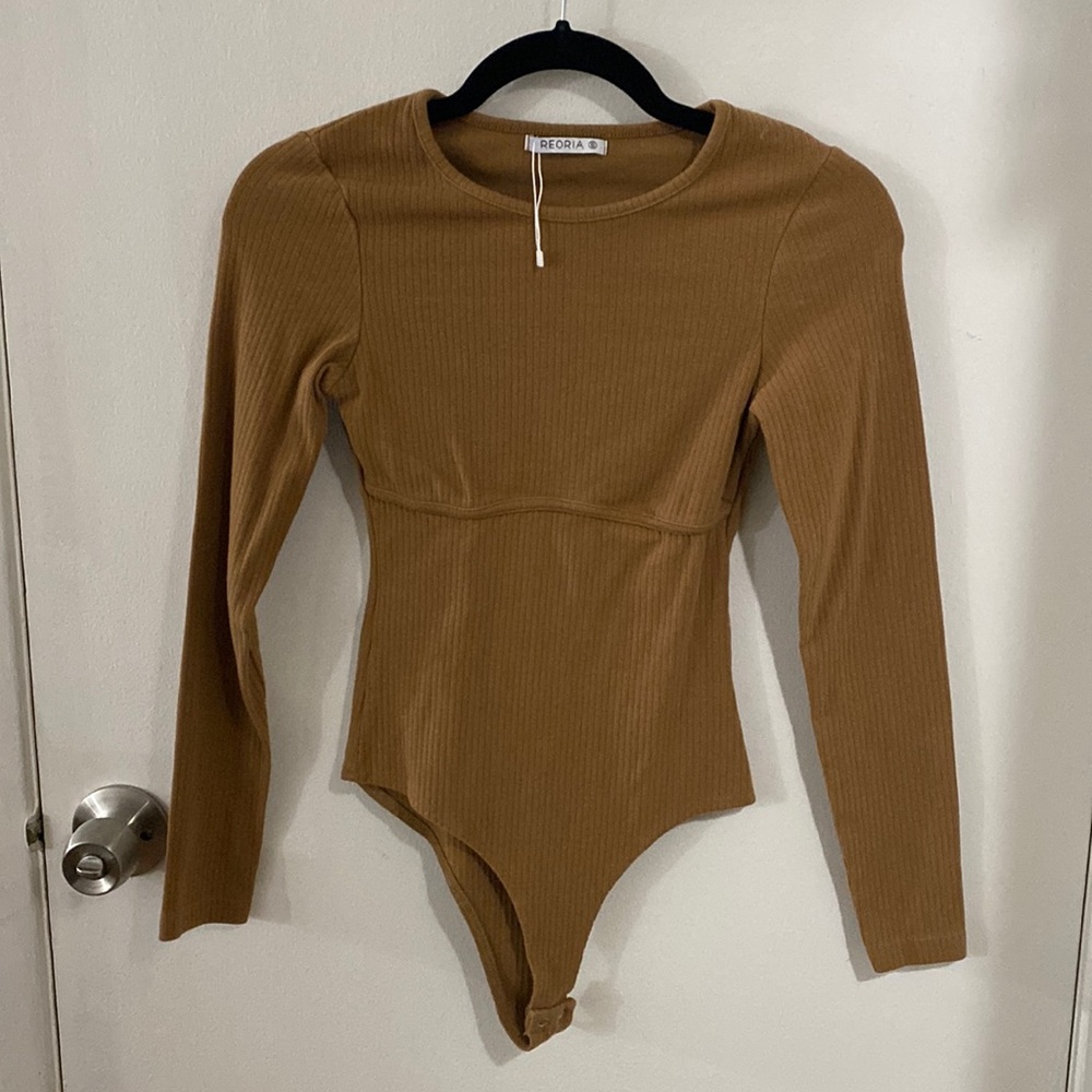 Never been worn, tags removed dark tan bodysuit. Snap closures